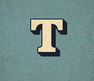Decorative letter T in vintage typographic style