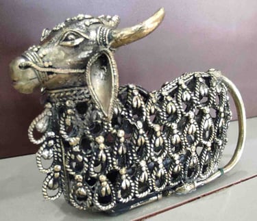 Decorative brass figurine of a sitting bull featuring intricate tribal cutwork design-Export-ready"