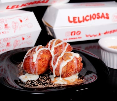 a plate of doughnuts with a cup of coffee