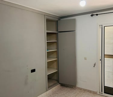 a room with a door and a closet