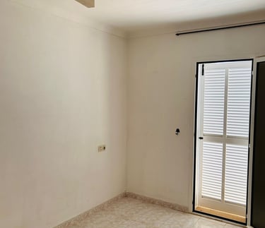 a room with a sliding glass door and a sliding glass door