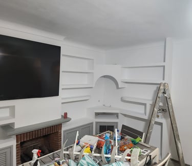 a television screen mounted on a wall in a room