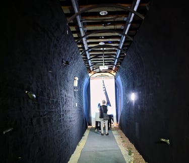 Blackened walkway leading to the exhibition