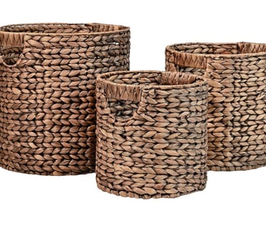 Set of three round woven seagrass storage baskets with handles for bathroom organization.