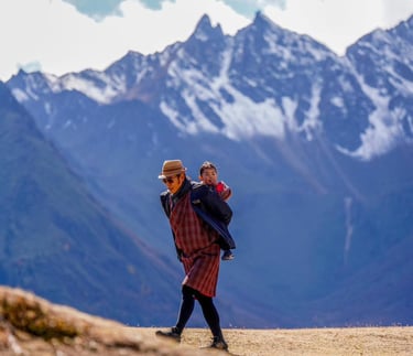 His-majesty-the-king-of-bhutan-with-princess-on-his-back-at-the-royal-highland-festival