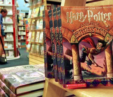  Copies of "Harry Potter and the Sorcerer's Stone" displayed in a bookstore, exemplifying the series