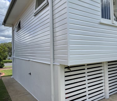 After exterior painting in Zillmere showing freshly painted white weatherboard