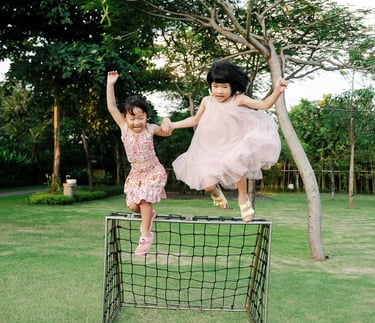 Children playing together at Padma Resort Legian Bali during relaxed family photography session.