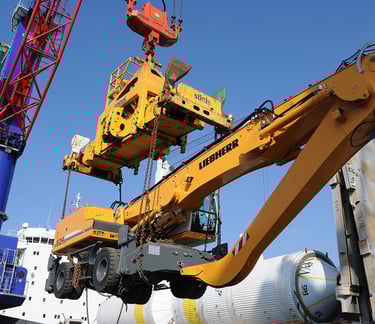 a crane crane is lifting a large container
