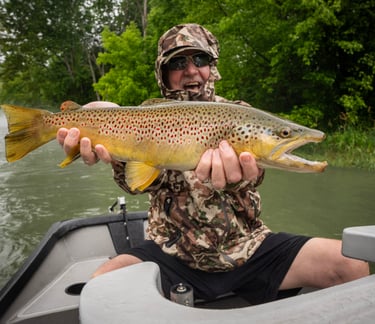 Check out Chris with this huge brown that ate a streamer!