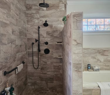a bathroom with a shower and a tub