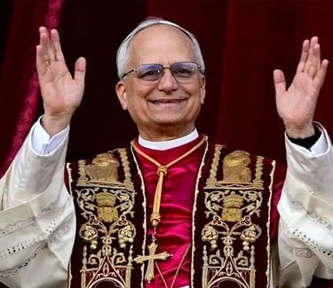 Papa Leon XIV in a priest's robes and glasses