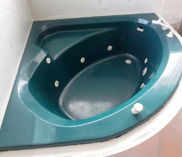 Old and outdated bathtub with jets