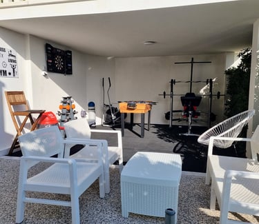 The photo shows an outdoor Fun and Fitness area with home equipment.