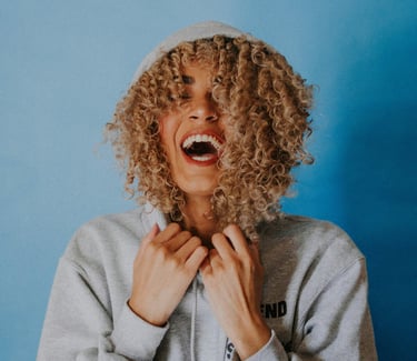 Smiling woman with a blue background