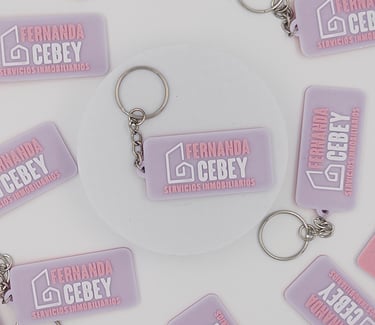 3d llaveros inmobiliaria Fernanda Cebey on a white background.