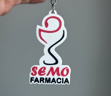 Custom 3D printed SEMO Farmacia llavero santo tomefeaturing a red and black bowl of Hygieia logo.