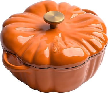Orange pumpkin shaped cast iron pot with a gold handle.