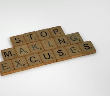 a wooden block with words that spell out the word stop making excuses
