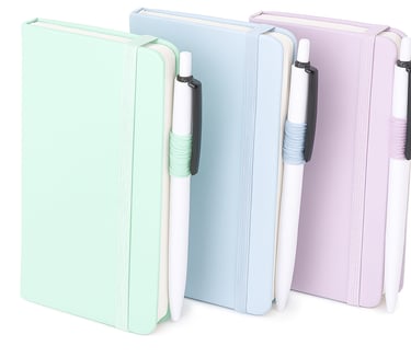 Three pastel notebooks with white pens on white