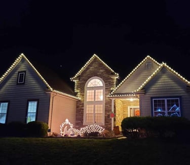 Charming home adorned with colorful Christmas lights, radiating festive cheer and holiday spirit.
