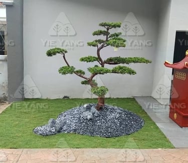 Bonsai pine tree with grey rocks and artificial turf – Yie Yang Landscape