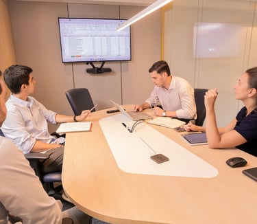 Virtual assistants in a meeting going through data