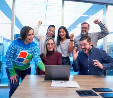 Image of virtual assistants celebrating in an office