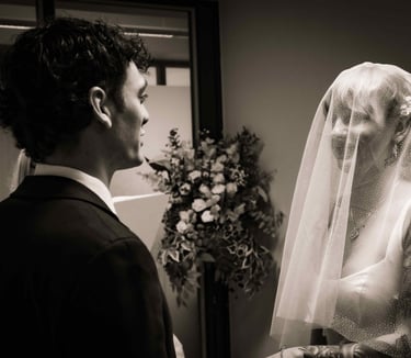 a man and woman in wedding attire