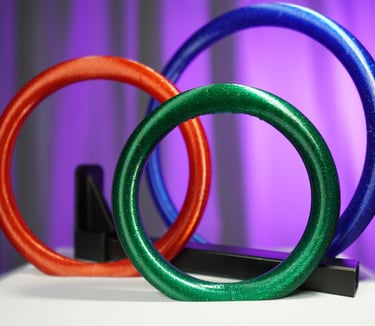 a group of three rings with different colored rings