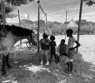 Laura Mommicchi in Africa with horses and kids