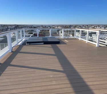 Custom framed floating rooftop decking over top of fiberglass.