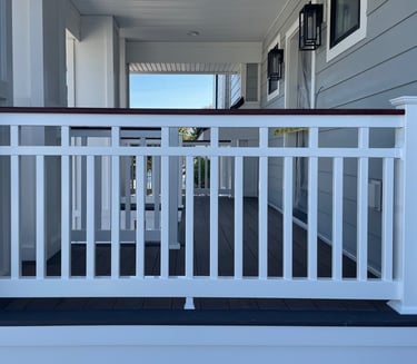 Vinyl patriot railing with mahogany woodgrain vinyl wrapped top