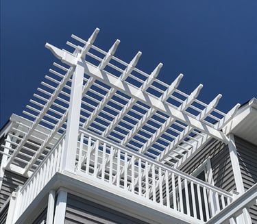 Vinyl pergola system integrated into deck railing
