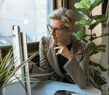 Female working professional looking at computer screen in a decorated office