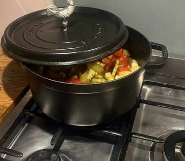 a potted potted with vegetables on a stove top