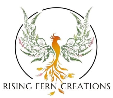 Rising Fern Creations logo with an orange phoenix and green fern-shaped wings inside a black circle