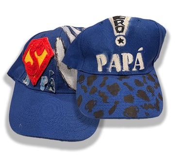 Baseball caps hand decorated by J.N.'s children.
