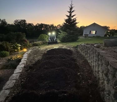 skid-steer-spreading-dirt-for-landscaping-project.jpg