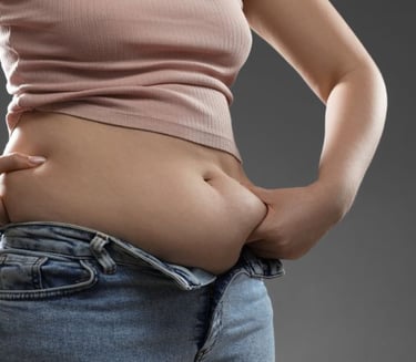 woman pinching her belly