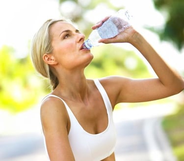 WOMAN drinking a bottle of water