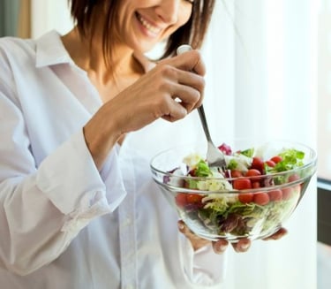 woman eating healthy salad