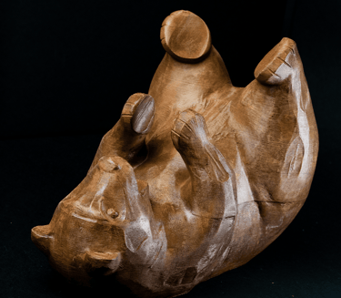 a large brown bear sculpture of a bear