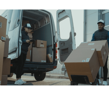 a man is moving boxes of boxes into a van