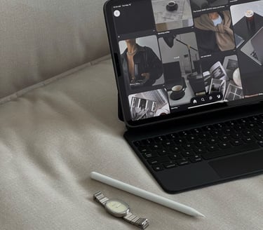 a laptop computer and a pen on a couch