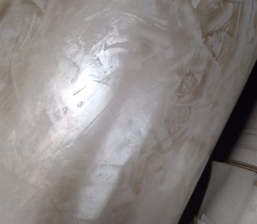 a white toilet with a toilet paper towel