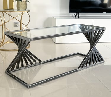 Table basse unique en métal avec effet accordéon plateau verre style industriel