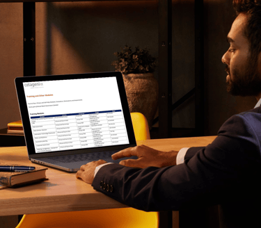 Professional reviewing Celagenix governance capability training modules on laptop