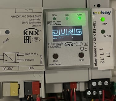 Jung KNX IP Interface IPS300SREG and ekey home CV smart home automation modules installed in an electrical panel.