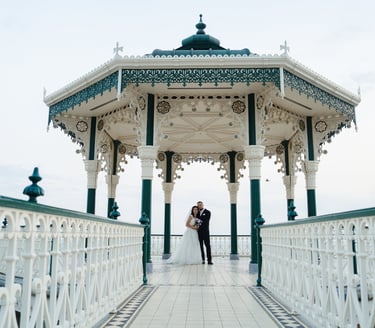Newly weds holding each other and posing for a photograph